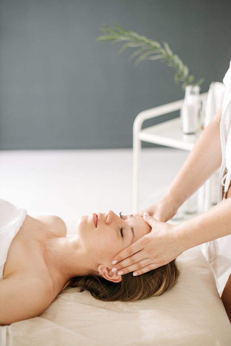 Calm and rejuvenating head massage therapy session with a relaxing ambiance.