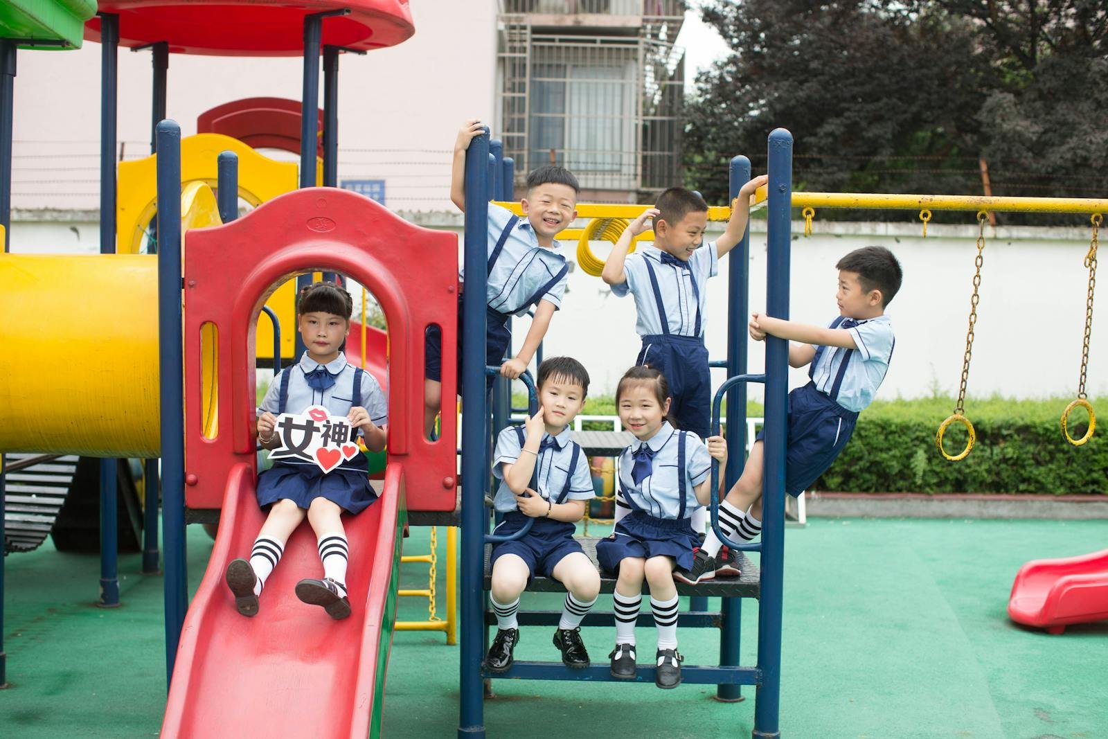 Group of children playing happily at a vibrant playground. Outdoor fun and joy.